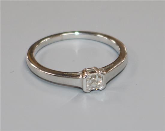 A modern 18ct white gold and asscher? cut solitaire diamond ring, size O.